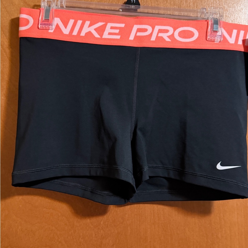 Nike Women's Black and Orange Pro Athletic Shorts